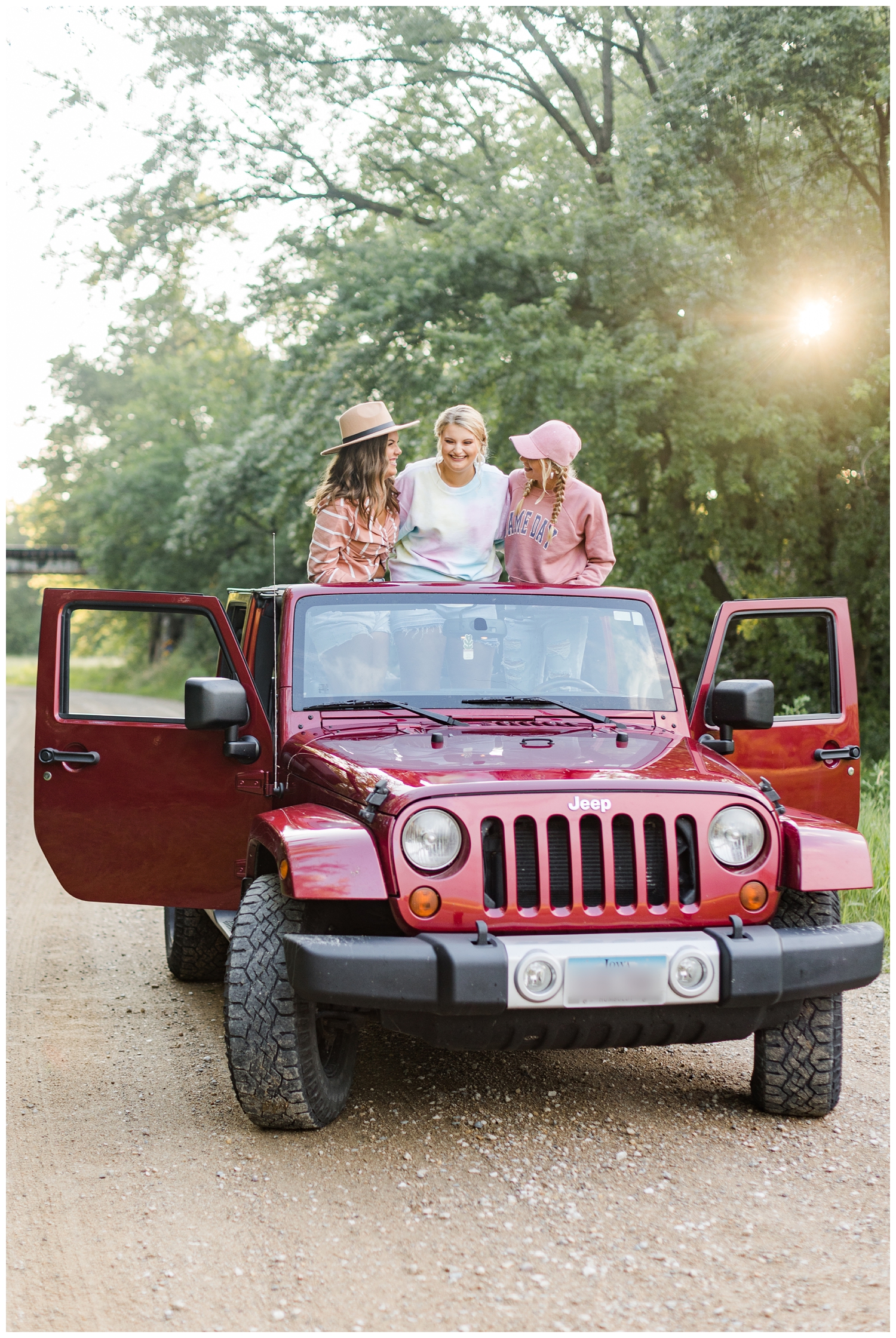Senior girls road trip in a maroon Jeep | CB Studio