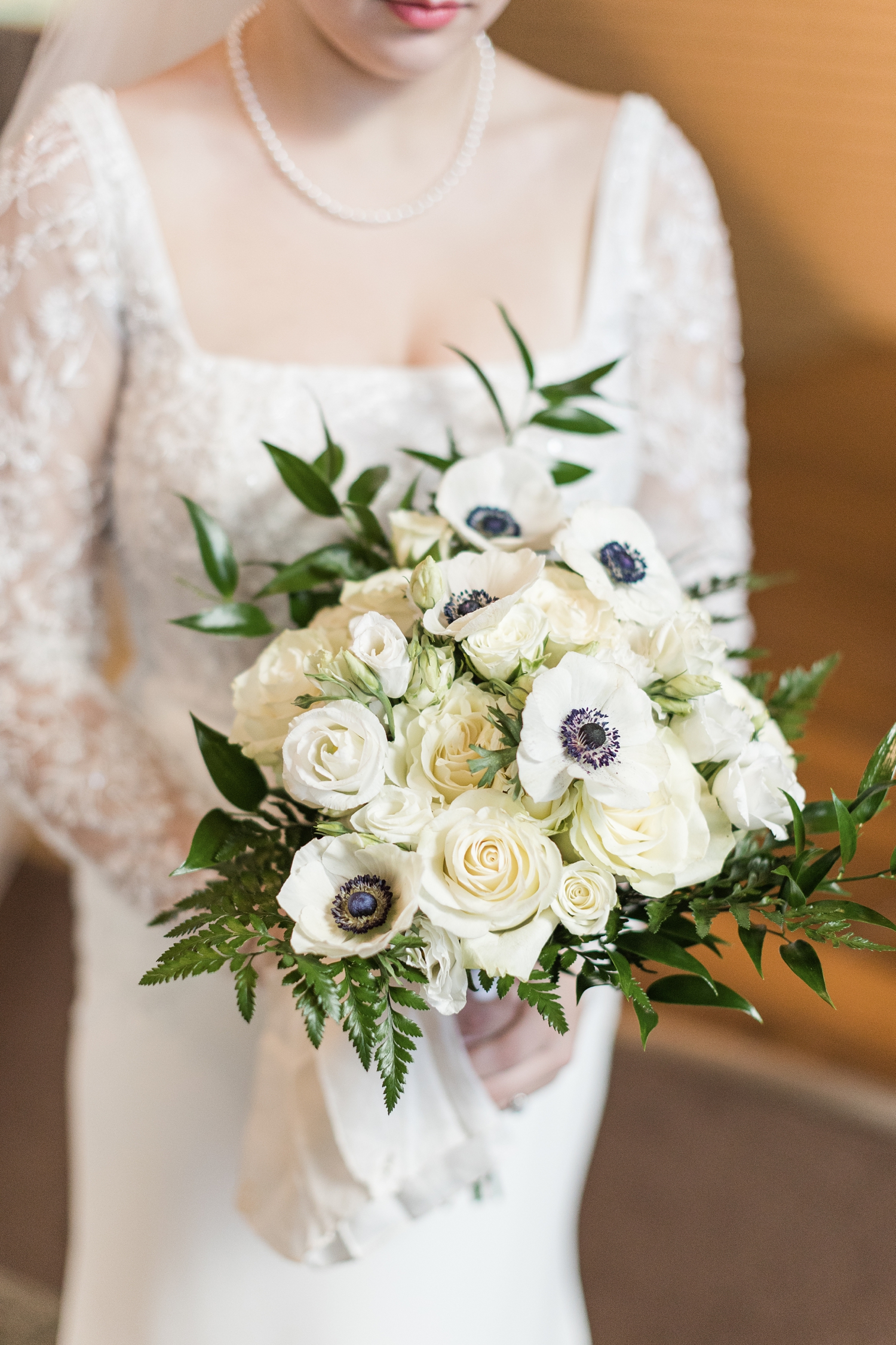 Stunning all white wedding bouquet with white roses and anemones | CB Studio