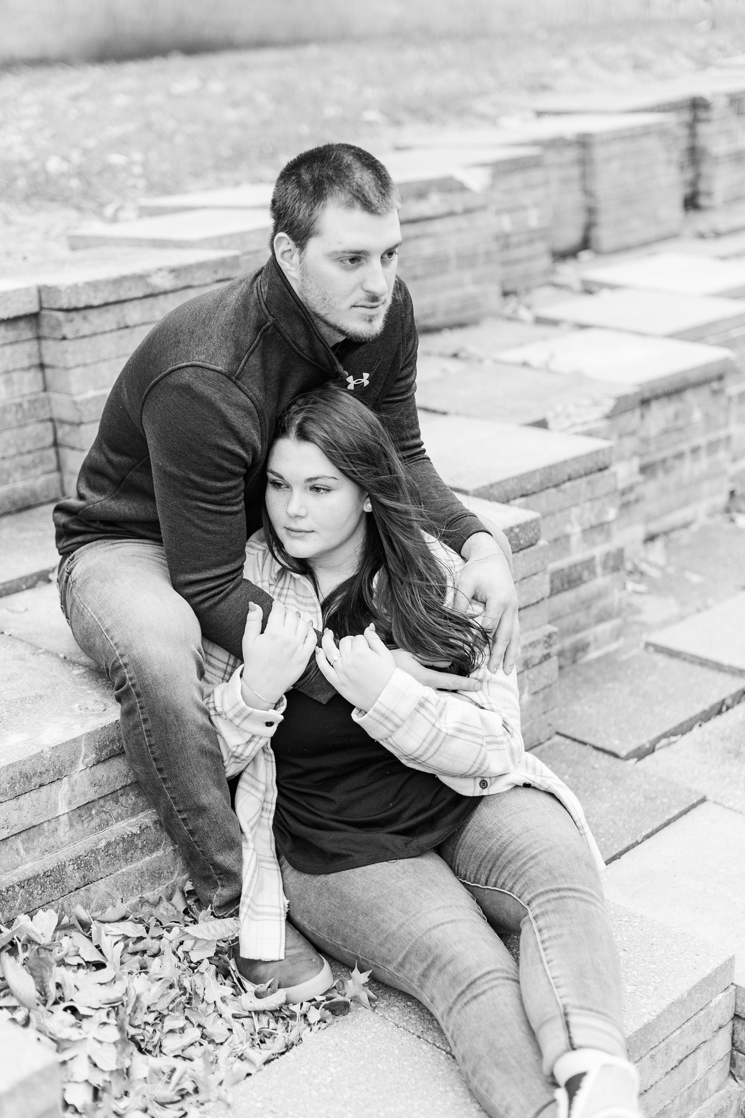 Mary and Austin sit on block stairs in downtown Fort Dodge, IA | CB Studio