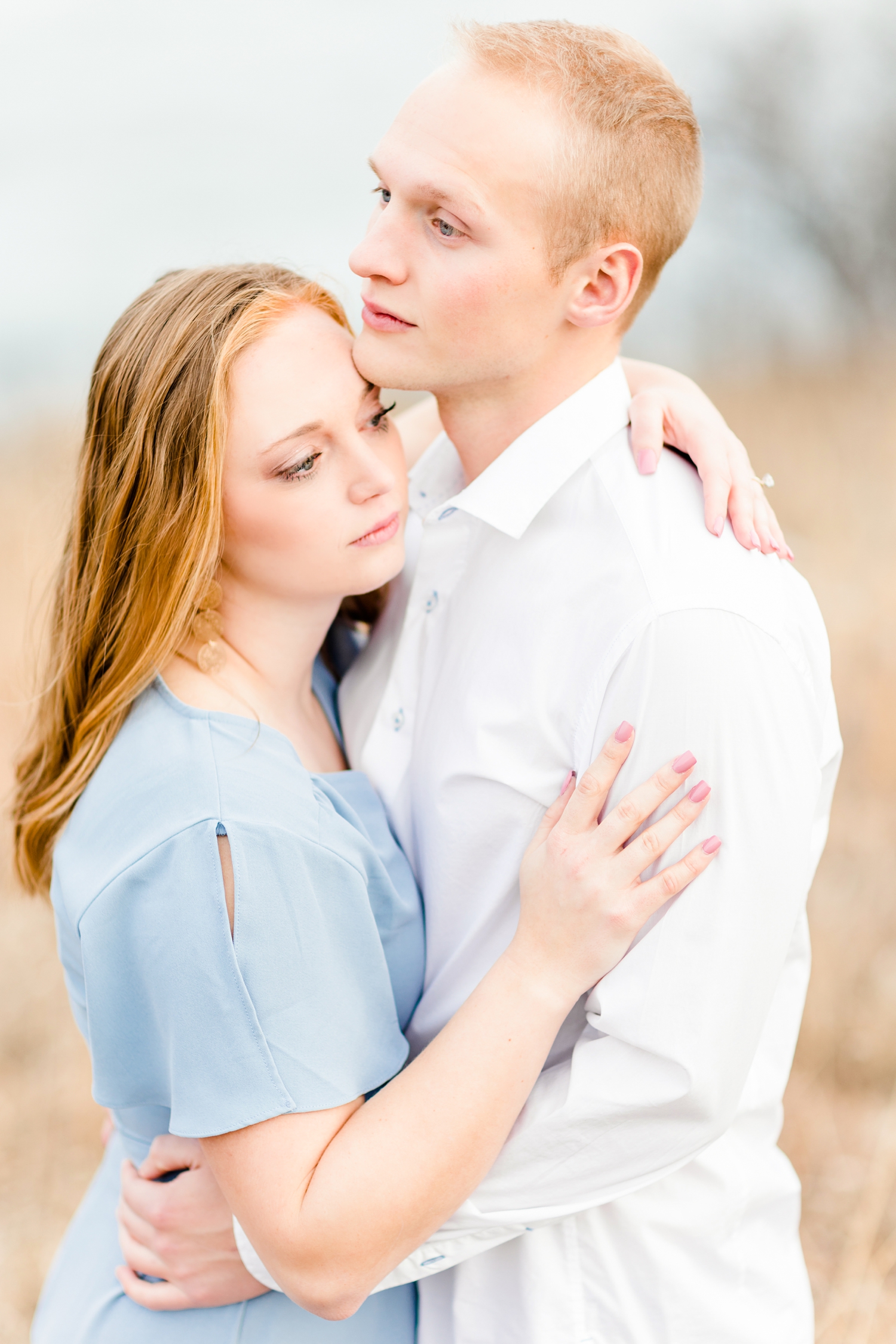 Brenna and Jacob embrace at Water's Edge Nature Center. | CB Studio