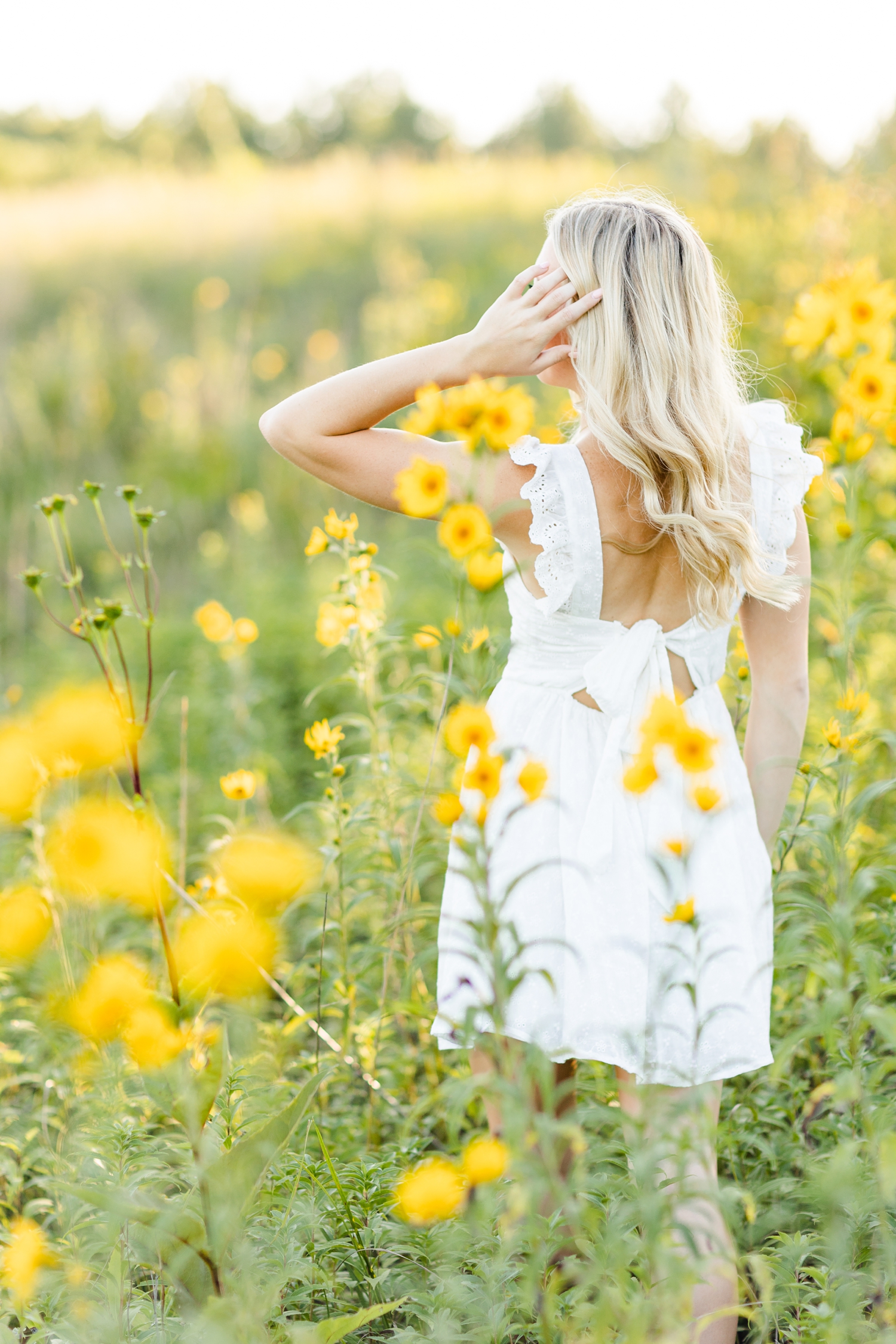 Shelby walks gracefully in a field of yellow wildflowers | CB Studio