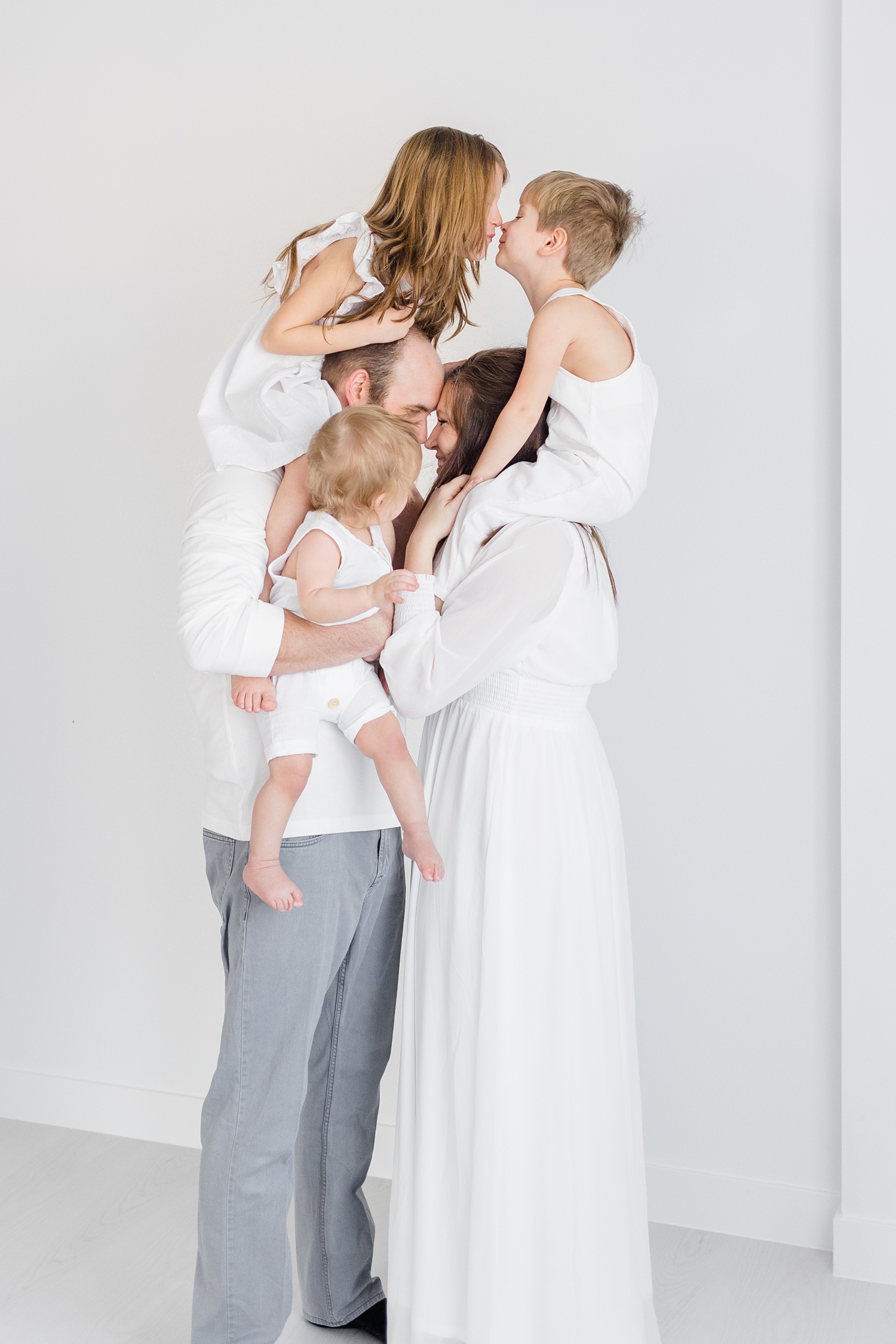 Schreiner family during a signature white studio photography session | CB Studio