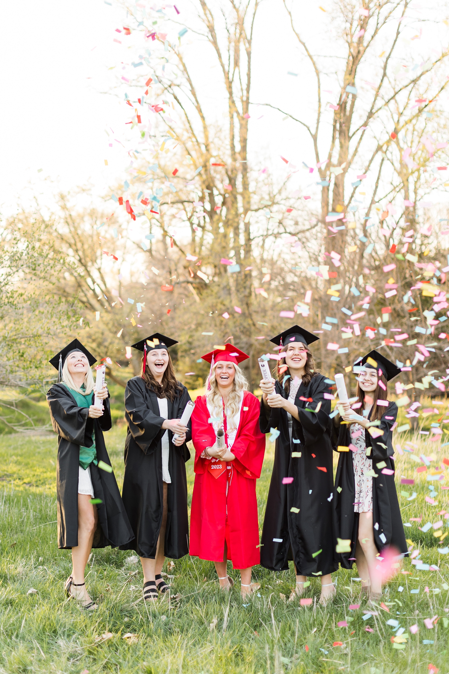 2023 CBS Senior Spokesmodels pop off confetti canons during a cap and gown photoshoot | CB Studio