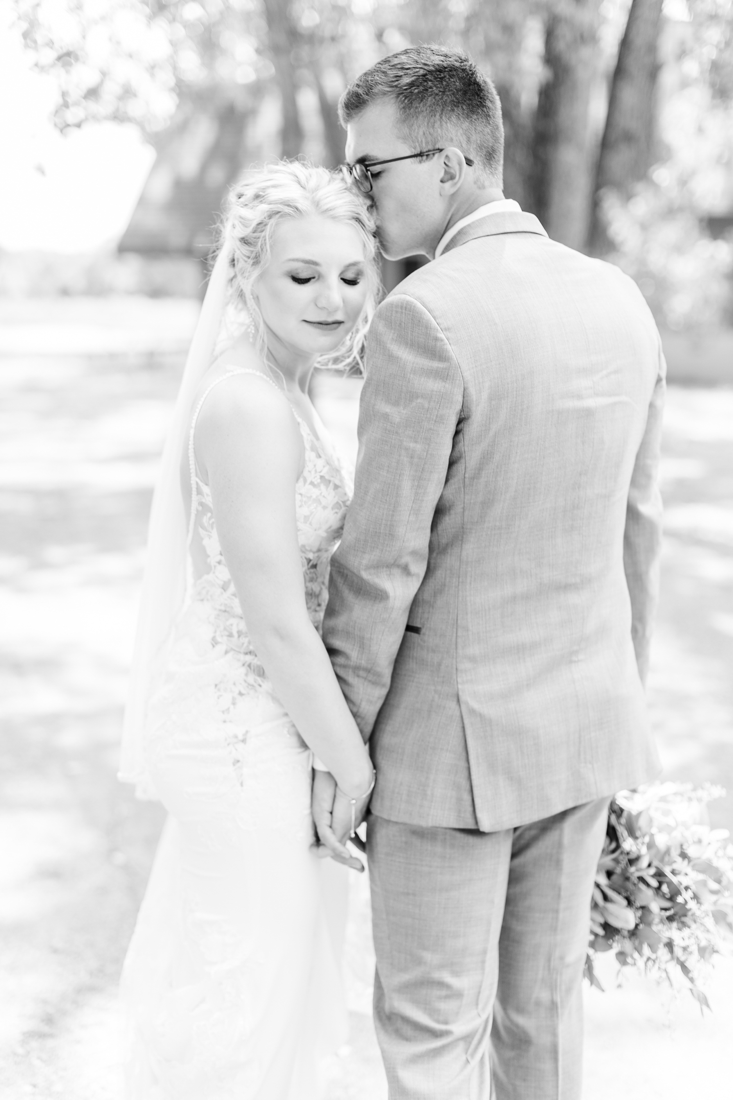 Quinton nuzzles Alli while she looks back down over her shoulder at Wild Haven in Algona, IA | CB Studio