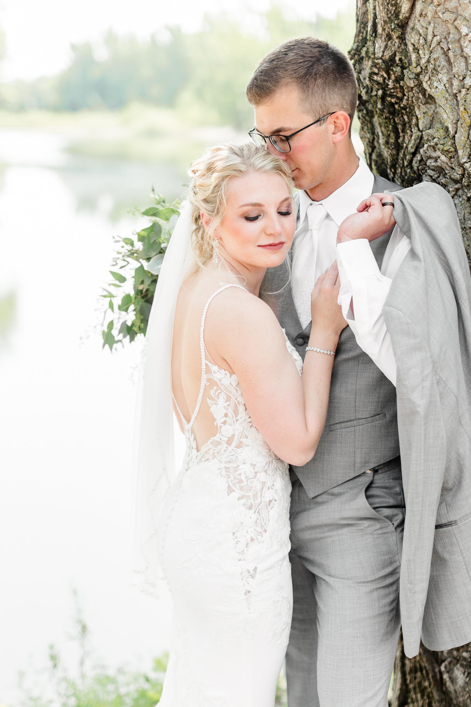 Quinton nuzzles Alli while she looks down over her shoulder at Wild Haven in Algona, IA | CB Studio