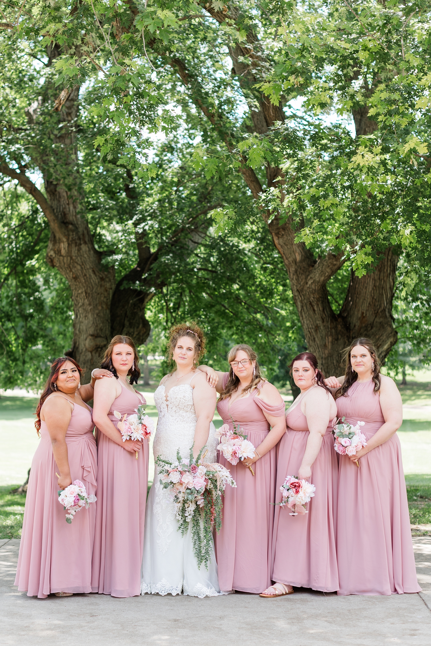 Bridesmaids pose wearing blush pink at The Shores at Five Island | CB Studio