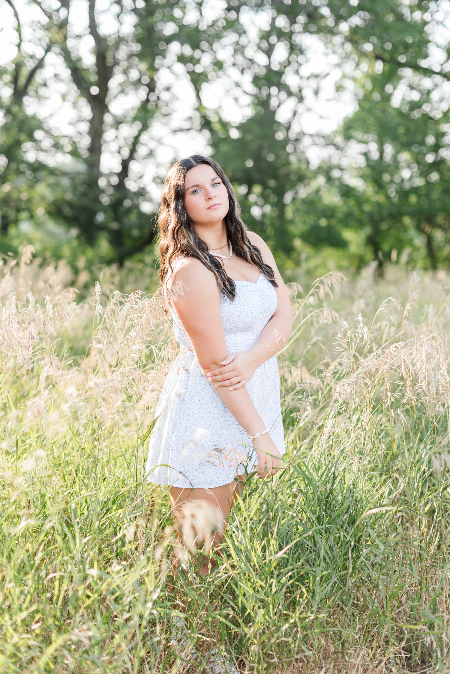 Lily stands in the middle of a grassy field | CB Studio