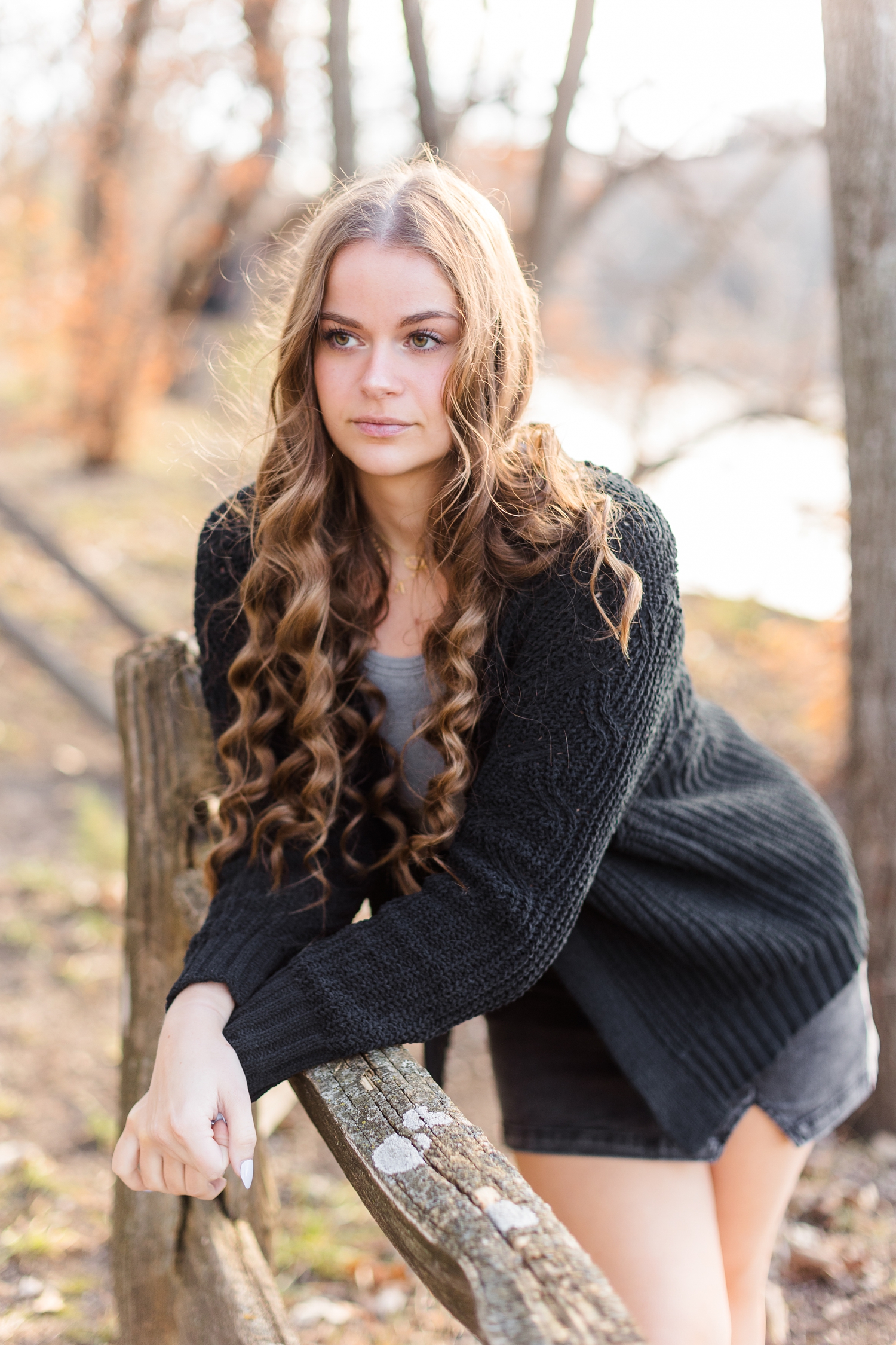 Avery leans on a wooden rail at Cottonwood Trail in Humboldt, IA | CB Studio