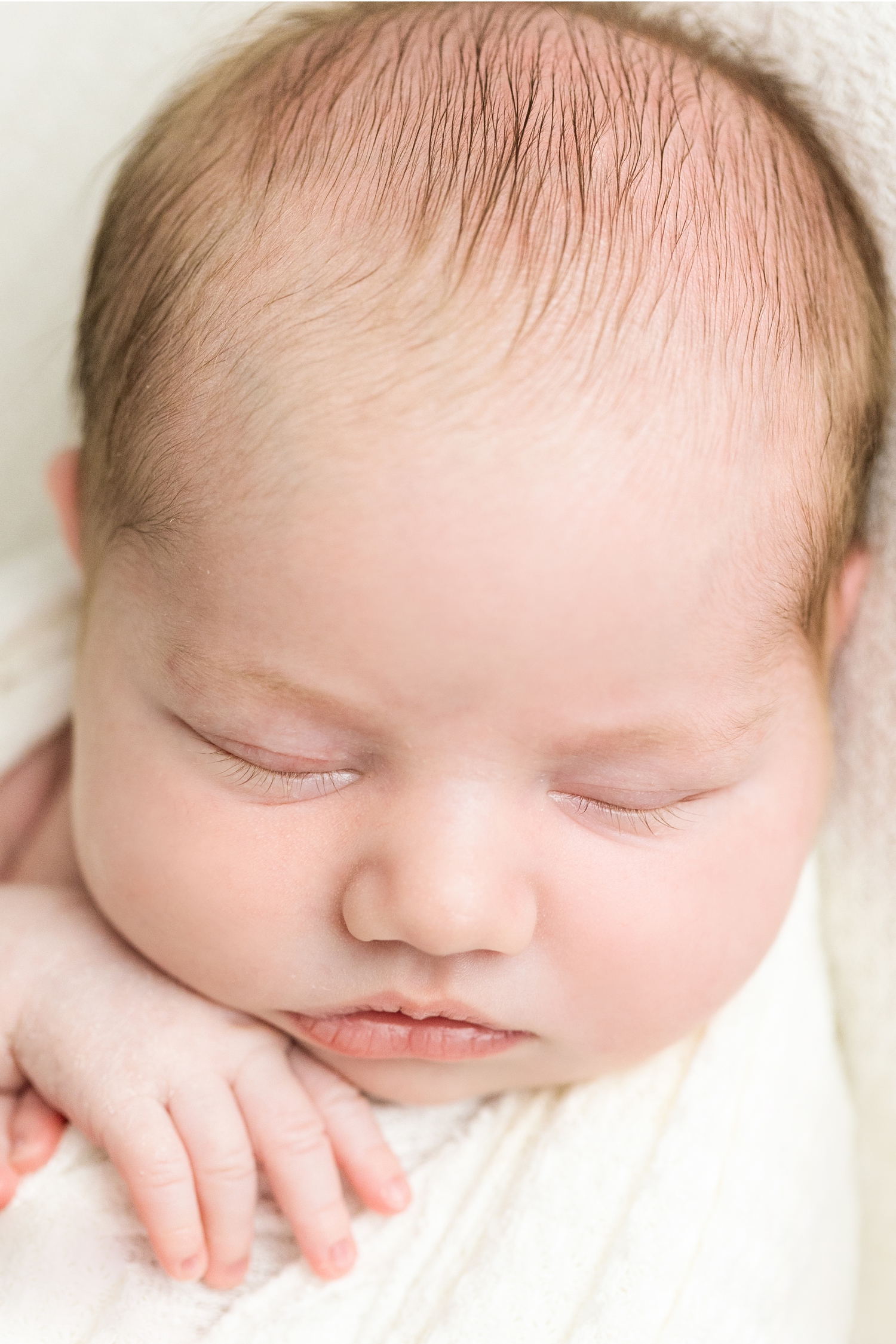Detail image of Baby Grace's face featuring her long eyelashes | CB Studio