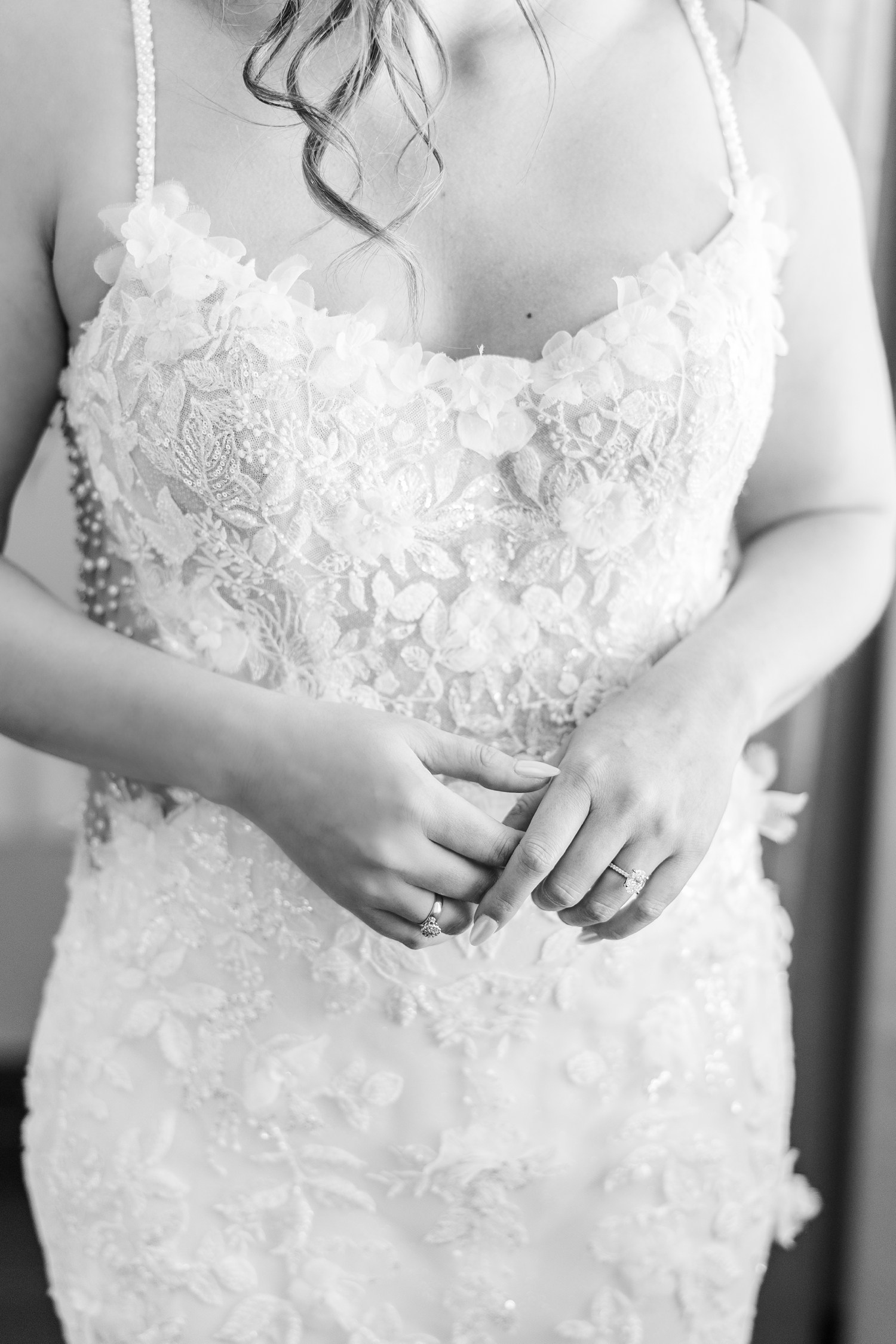 Jenna folds her hands in front of her torso while wearing her Morilee wedding gown, engagement ring and vintage heirloom grandmother's ring | CB Studio