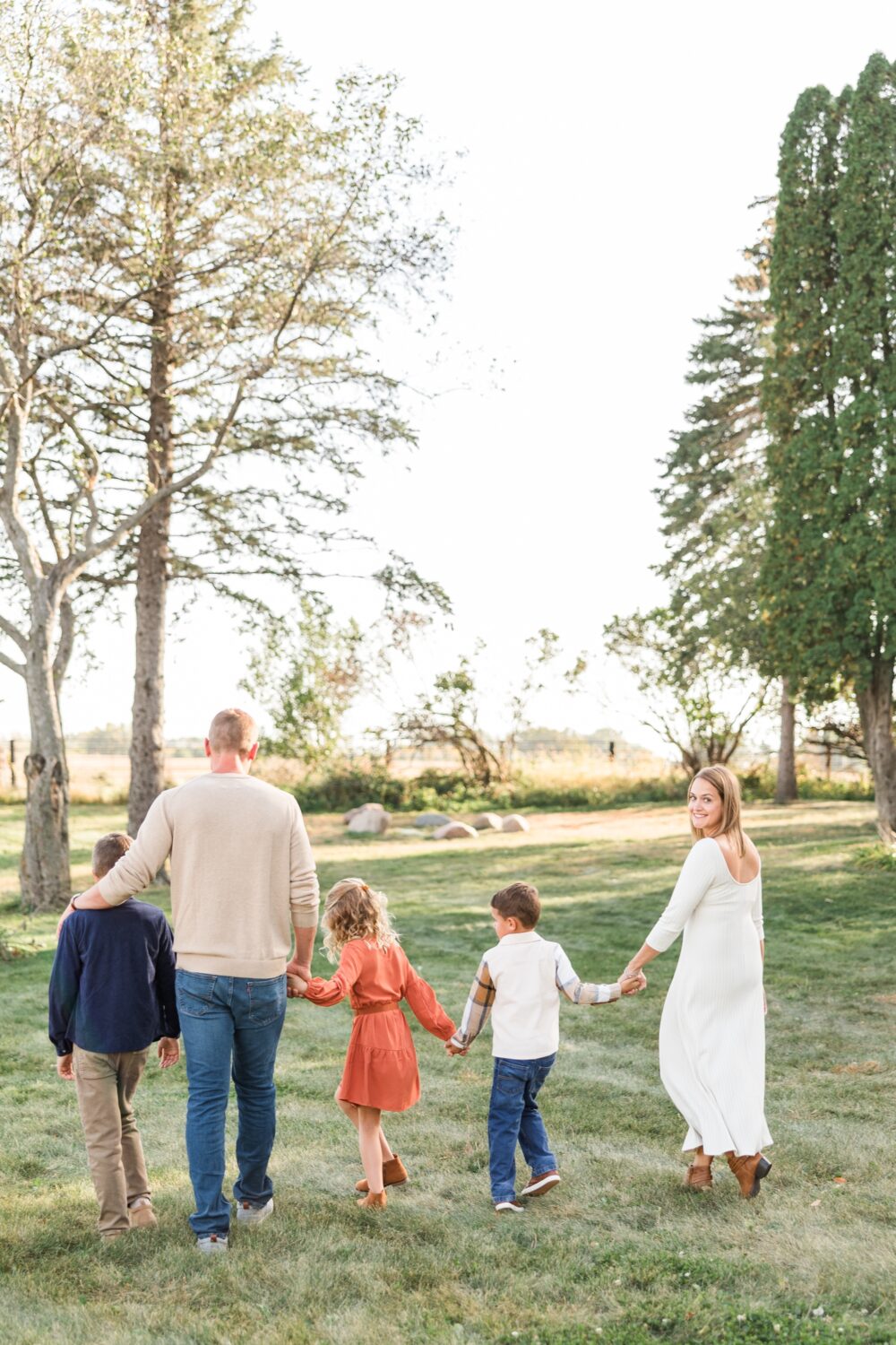 Best of 2024 Families | The Brantner family walks away holding hands as Jamie looks back and smiles | CB Studio