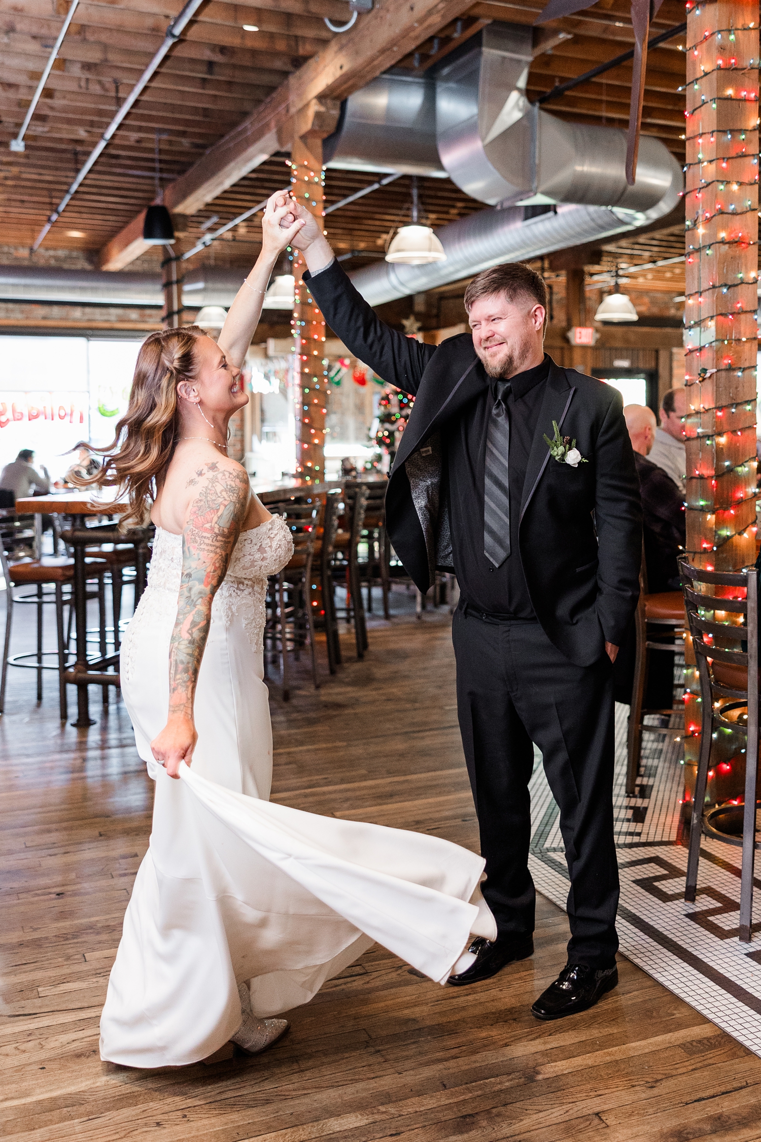 Chris spins his new bride, Lisa, as they dance in the Iowa Taproom | CB Studio