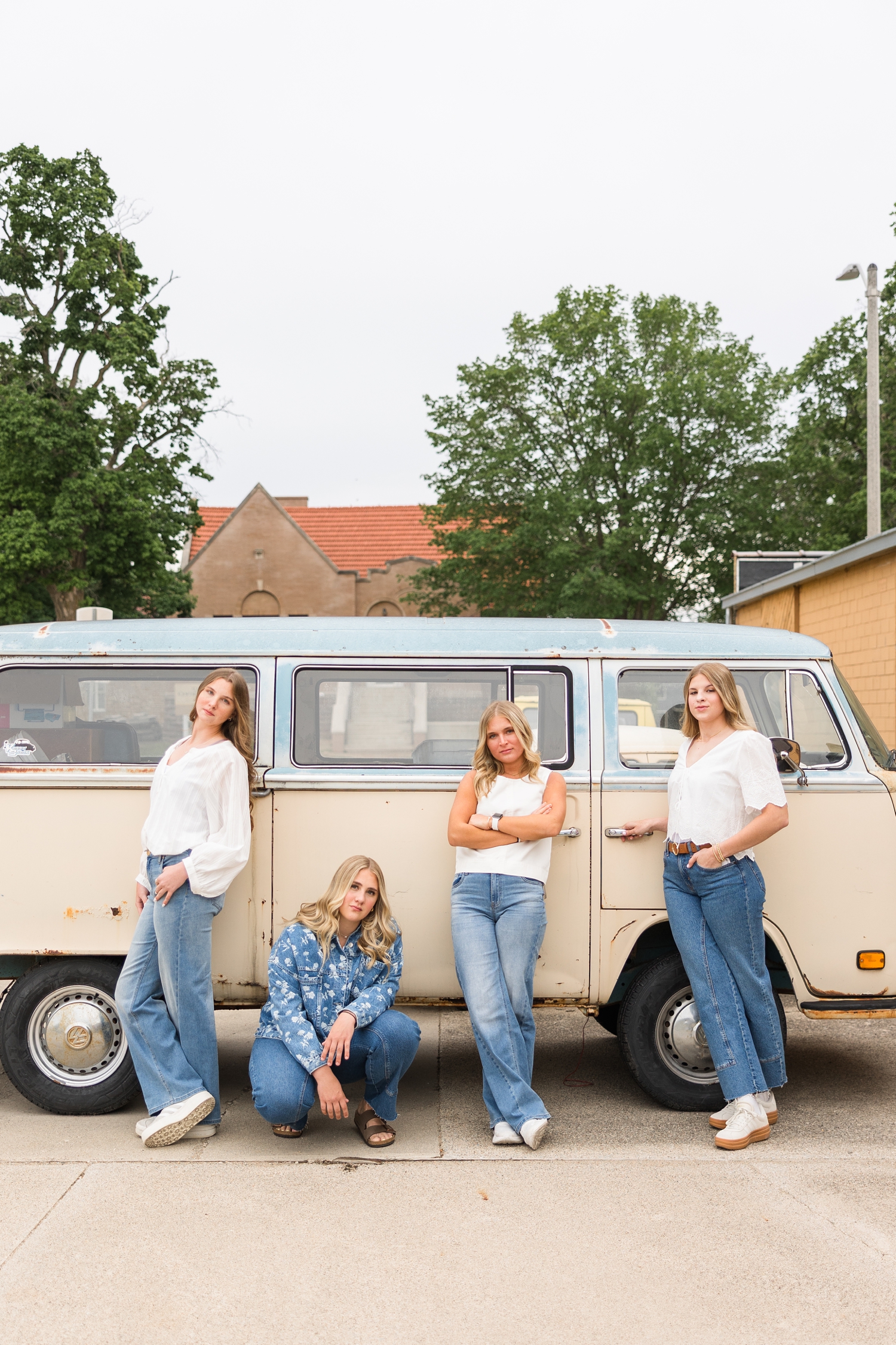TEAM 27 dressed denim styles, pose with attitude next to a two-toned tan and light blue Volkswagon van in Algona, IA | CB Studio